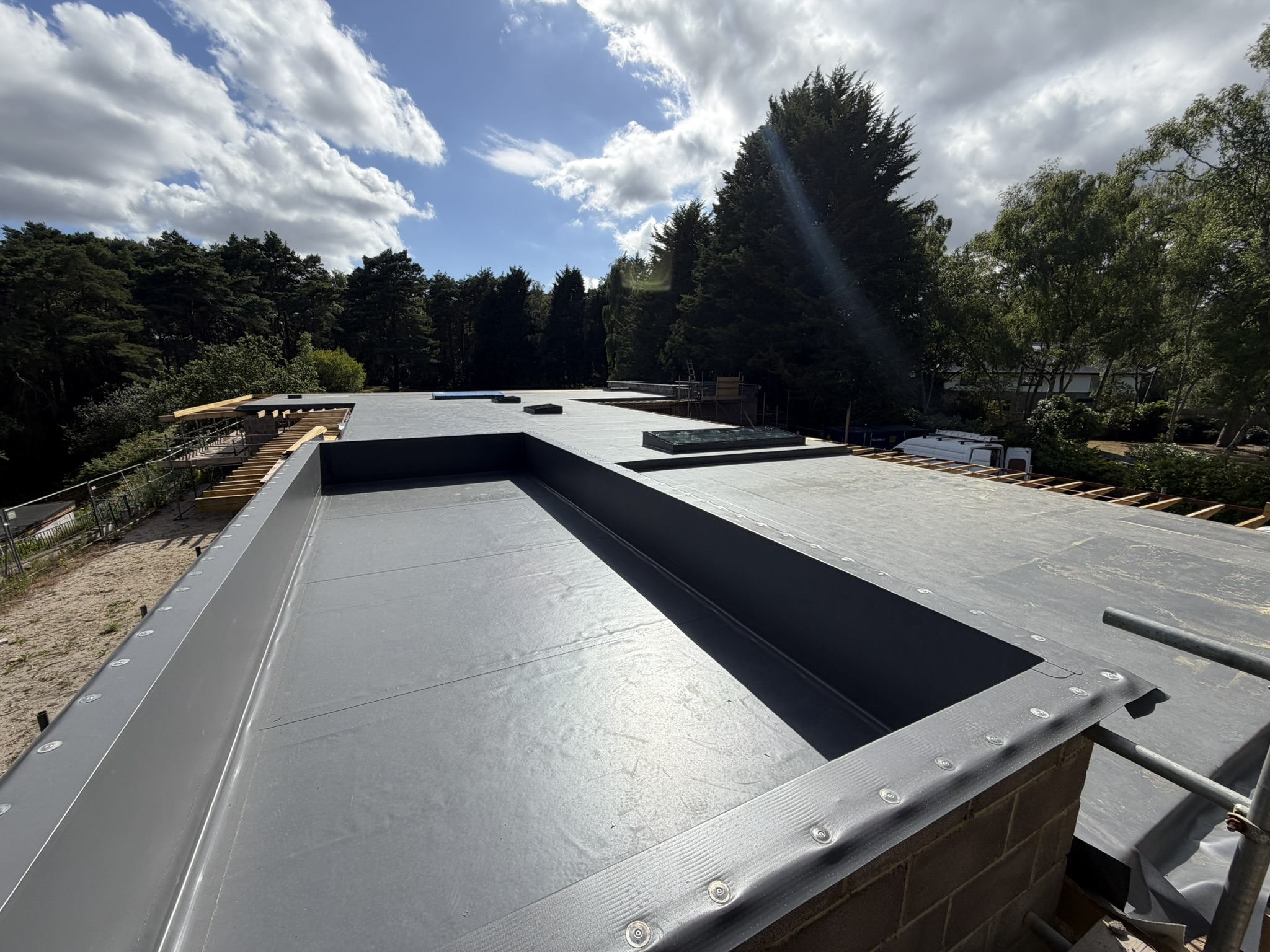 Large Siltec single-ply roof and perimeter box gutter on a new-build bungalow in Ringwood